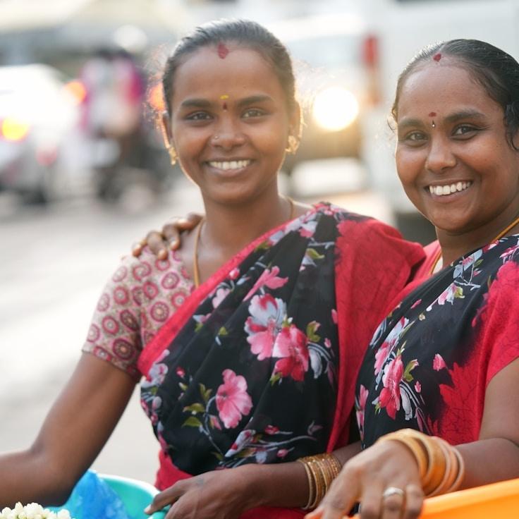 Anya Kapoor, Lead Design Curator at Bright Season Project, reviewing corporate floral arrangements